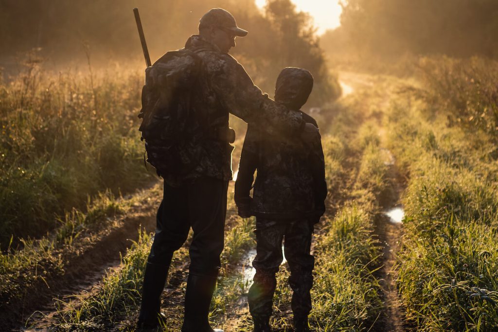 Father and Son hunting at sunset